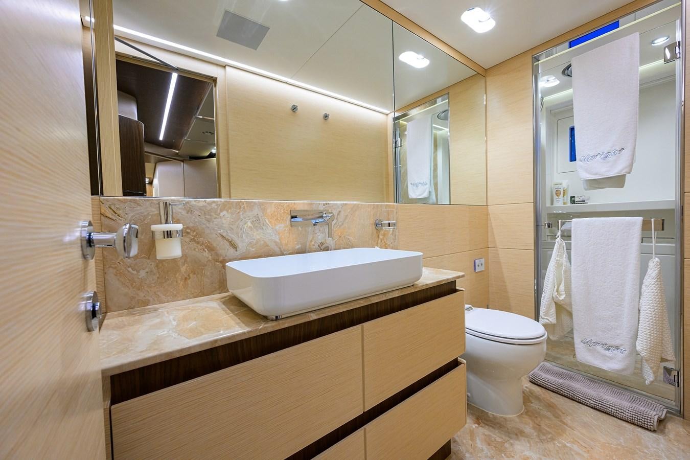 a bathroom with a sink and toilet aboard UPTIGHT Yacht for Sale