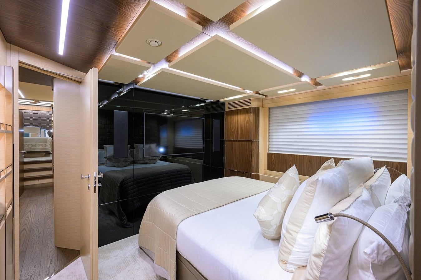 a room with a bed and a couch aboard UPTIGHT Yacht for Sale