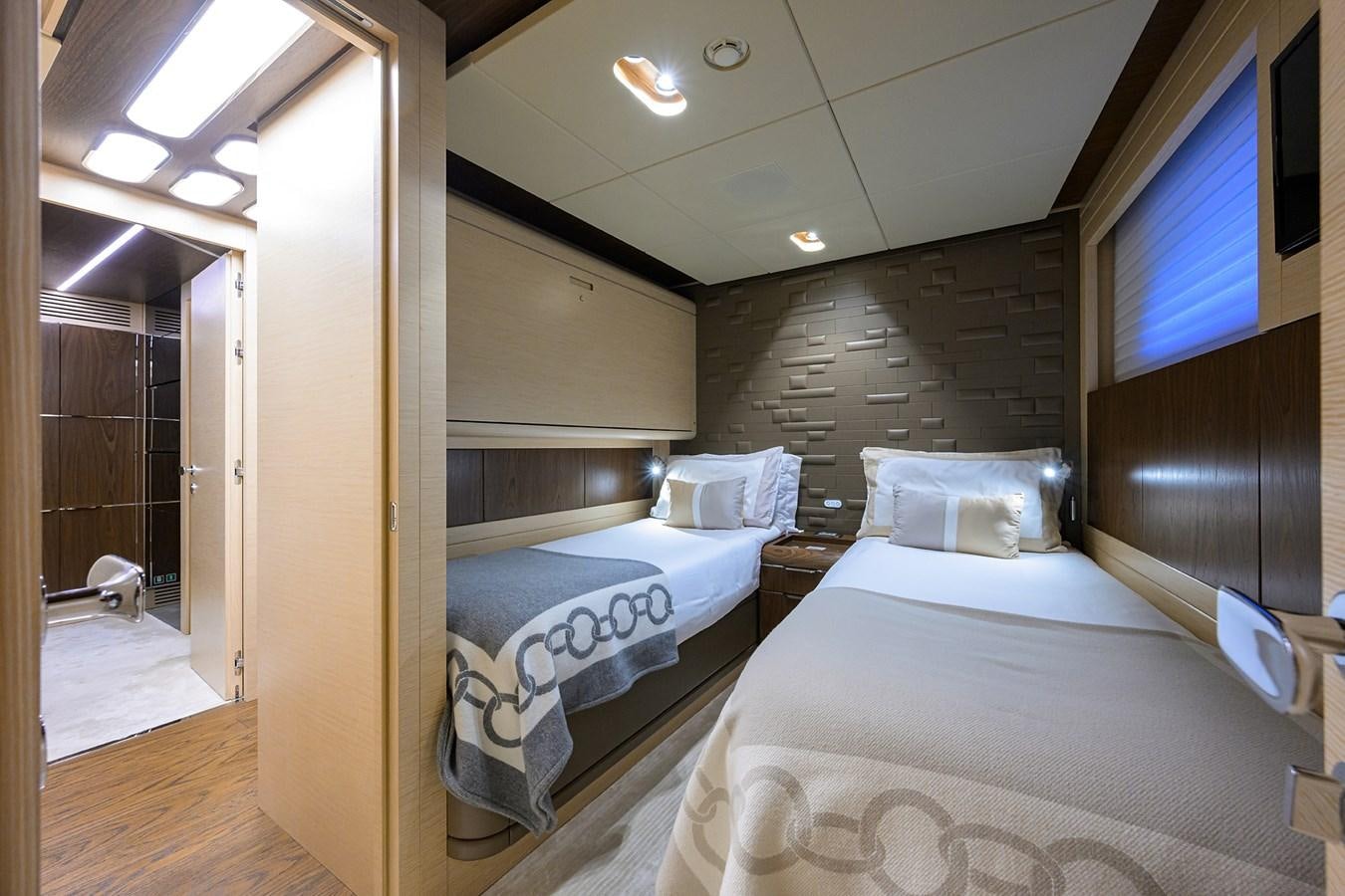 a room with two beds aboard UPTIGHT Yacht for Sale