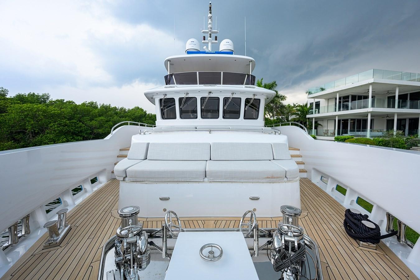 a white boat on a deck aboard UPTIGHT Yacht for Sale