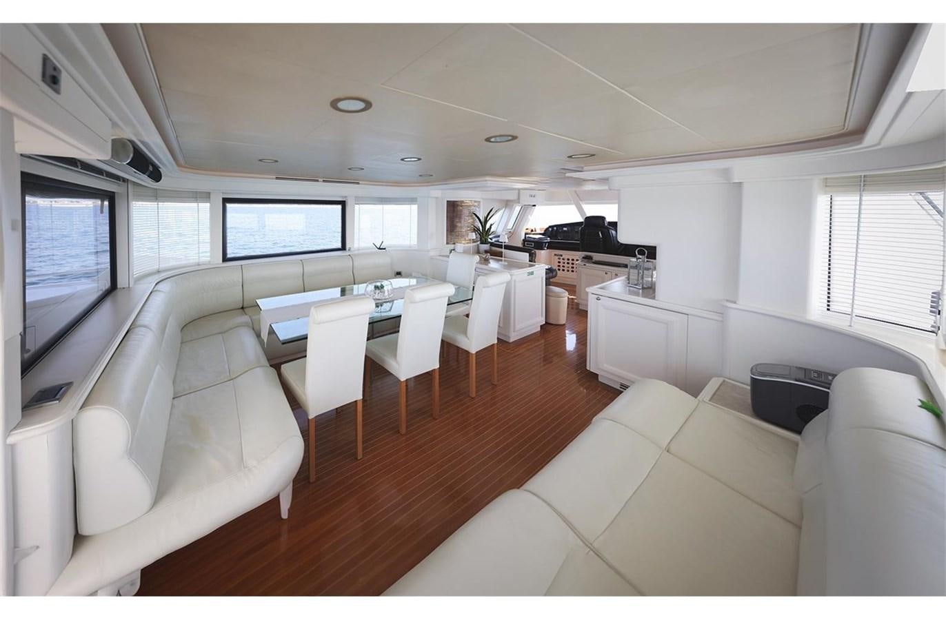 a room with a couch and a table and chairs aboard ZIACANAIA Yacht for Sale