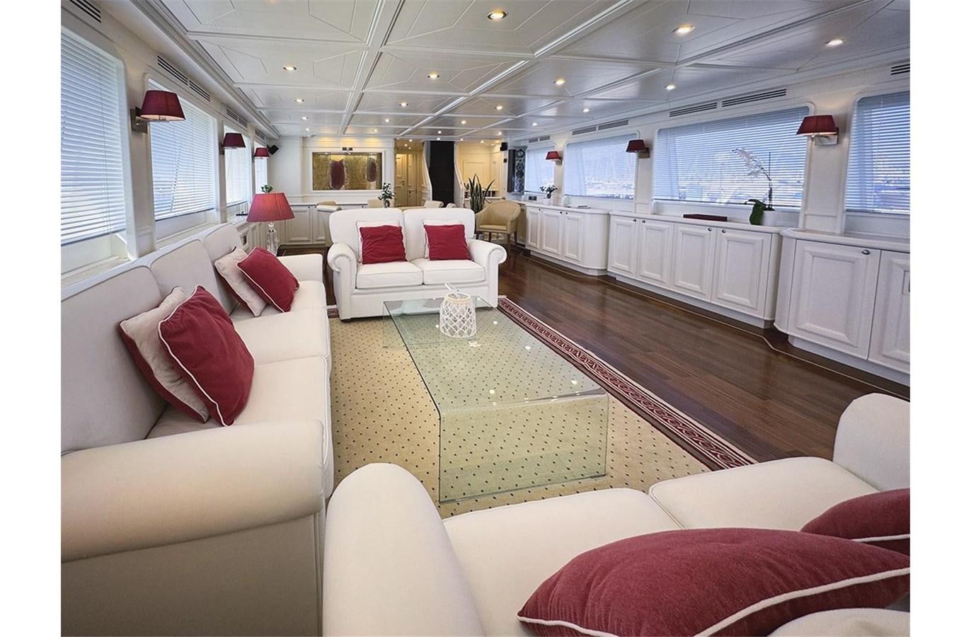 a large living room with white furniture aboard ZIACANAIA Yacht for Sale