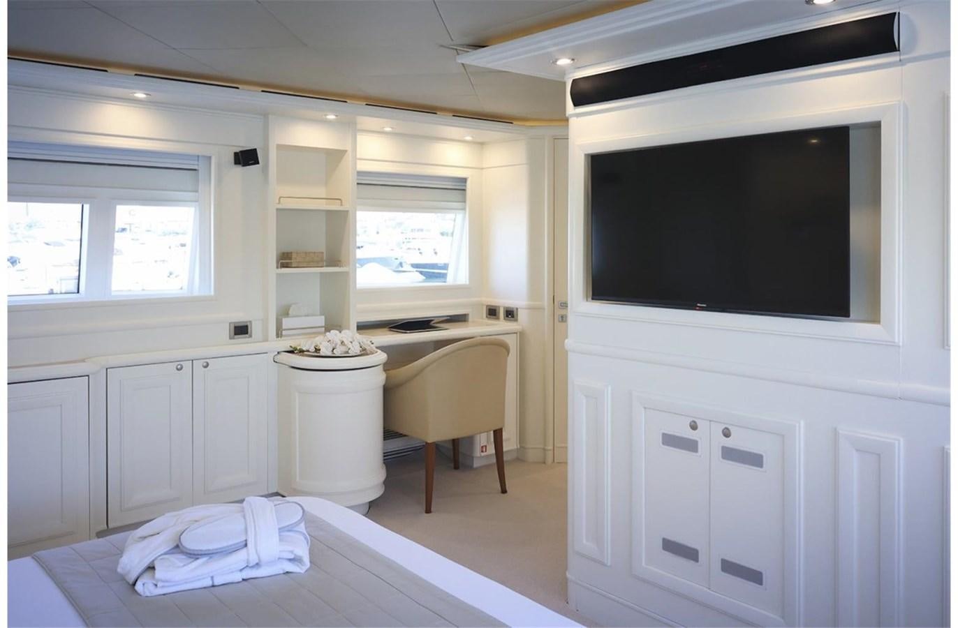 a room with a bed and a television aboard ZIACANAIA Yacht for Sale