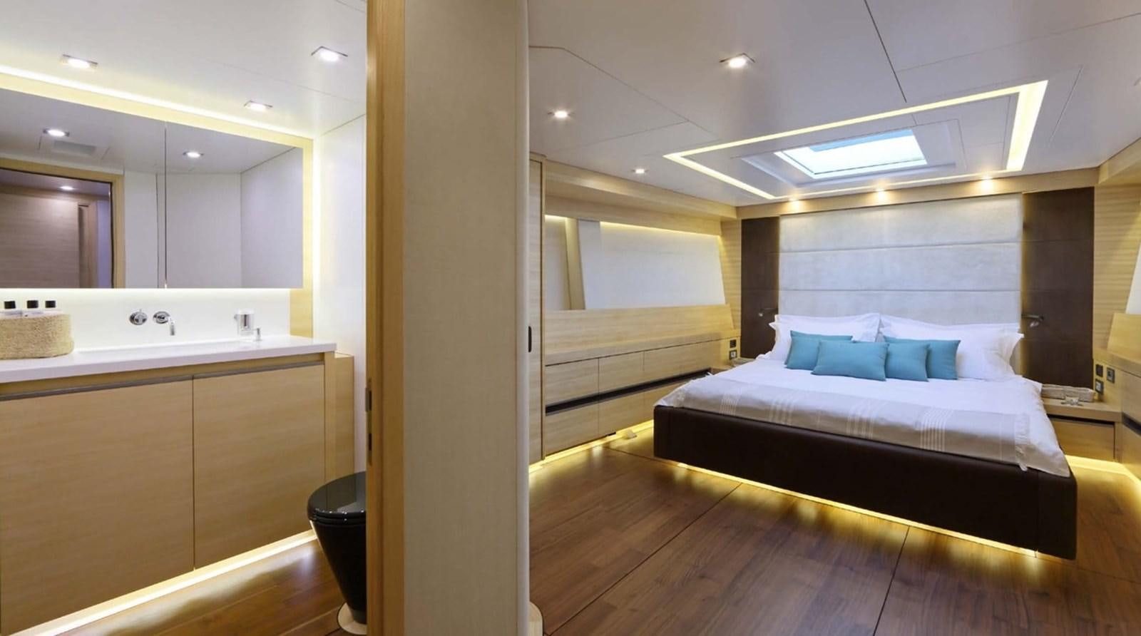a room with a bed and a sink aboard SPIRIT OF MALOUEN X Yacht for Sale