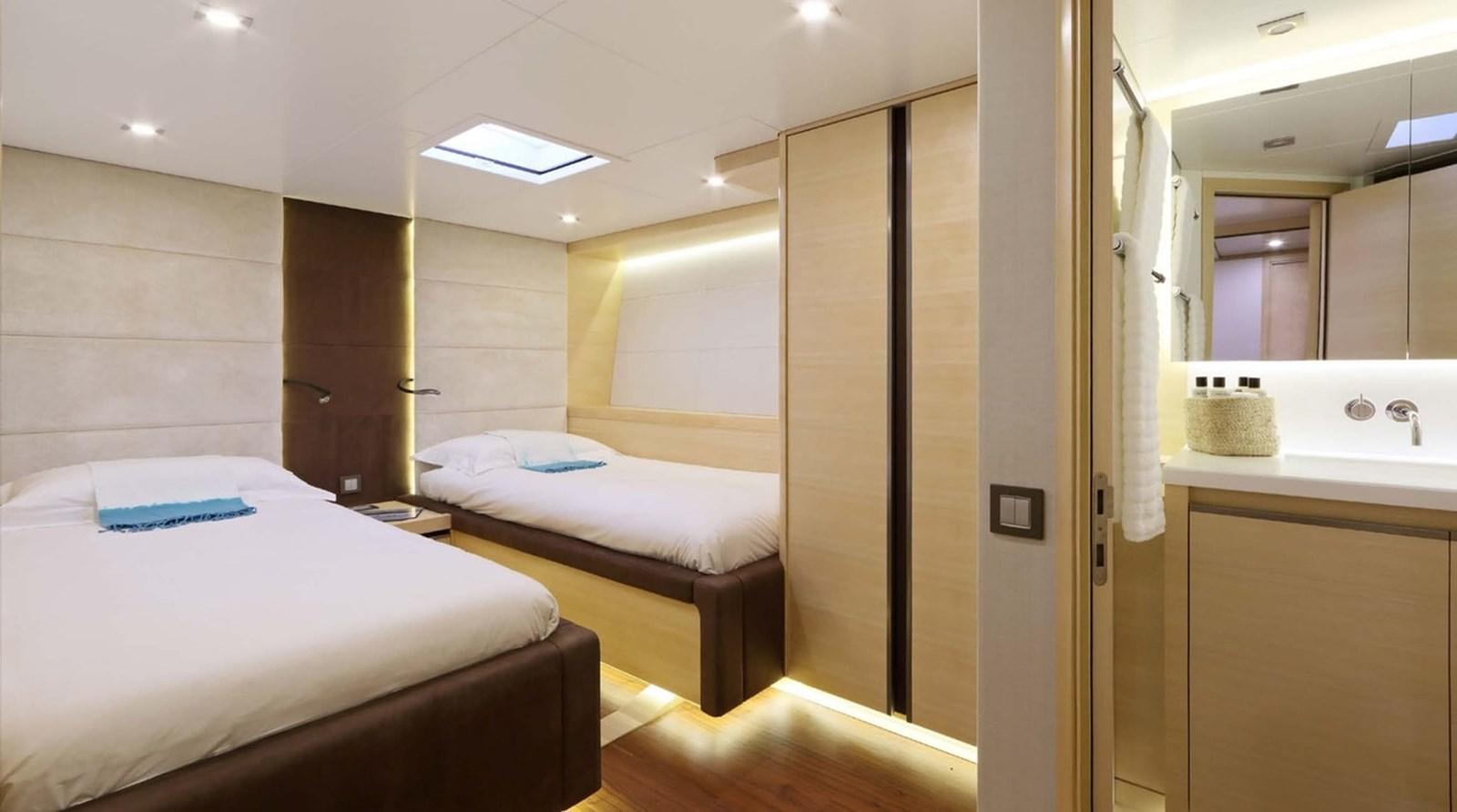 a room with two beds aboard SPIRIT OF MALOUEN X Yacht for Sale