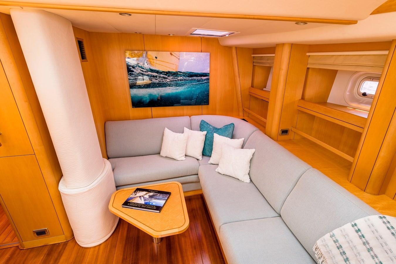 a living room with a couch and a table aboard RAVENCLAW Yacht for Sale
