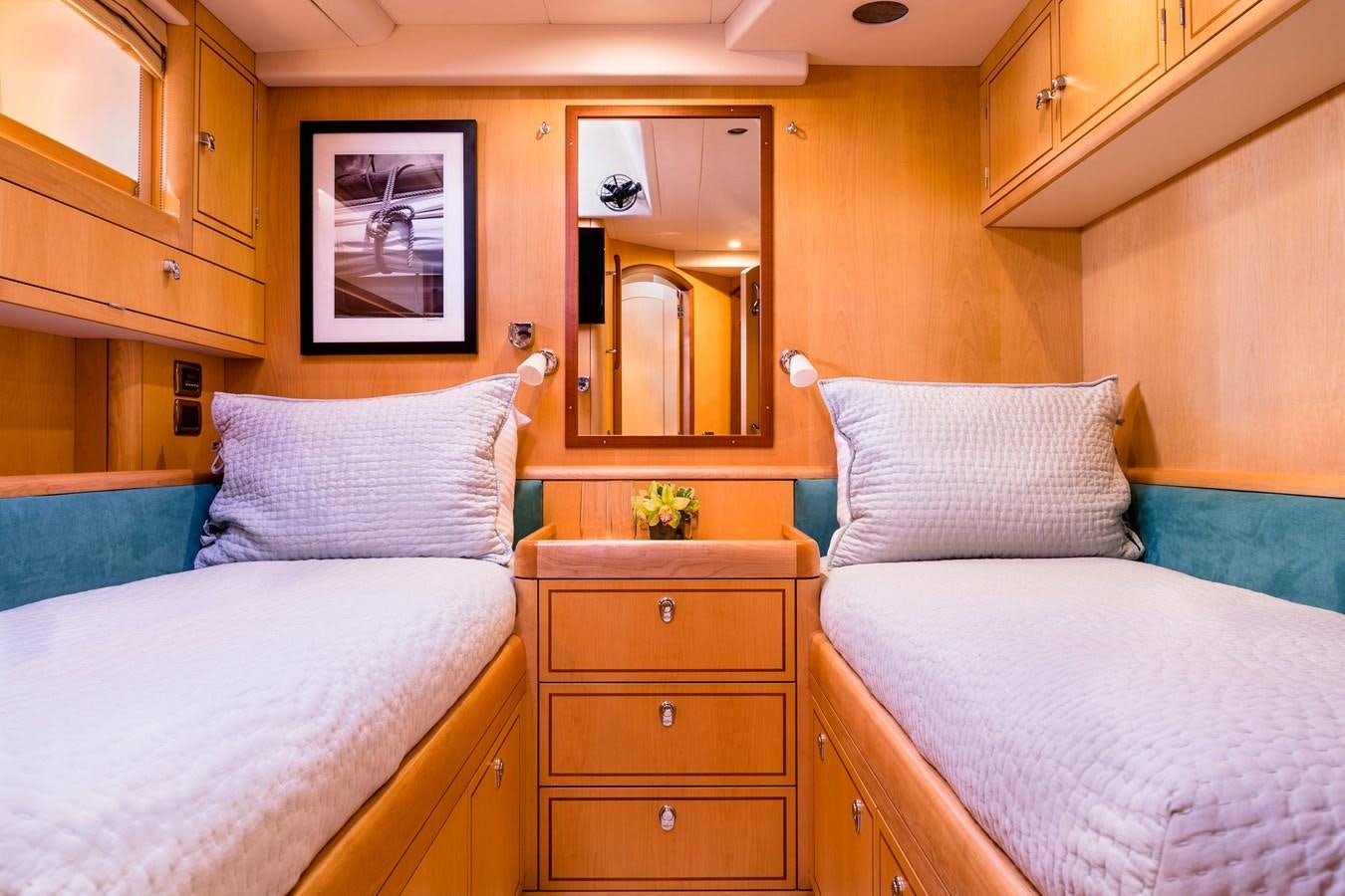 a couple of beds in a room aboard RAVENCLAW Yacht for Sale