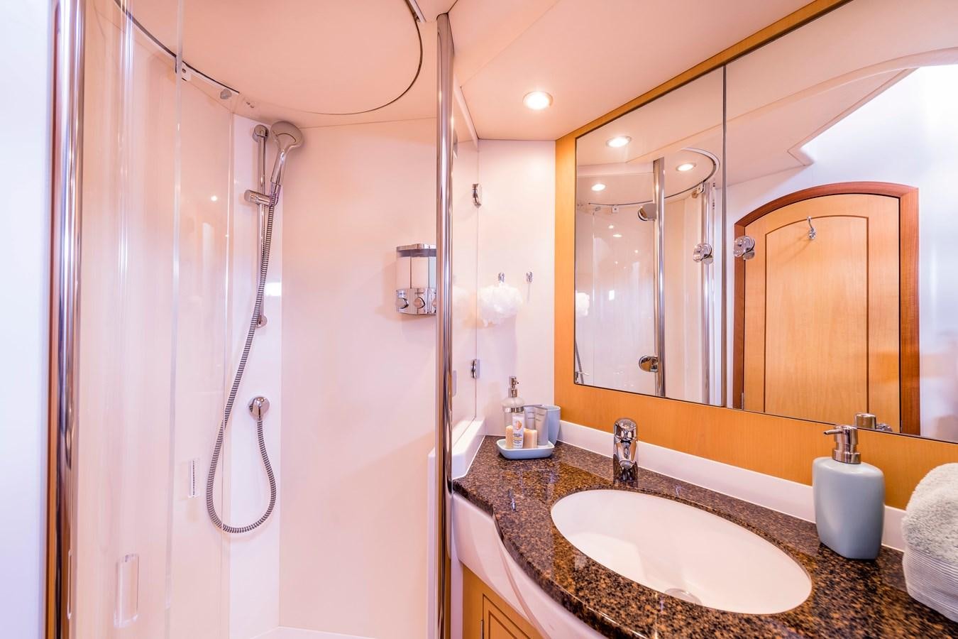 a bathroom with a sink and shower aboard RAVENCLAW Yacht for Sale