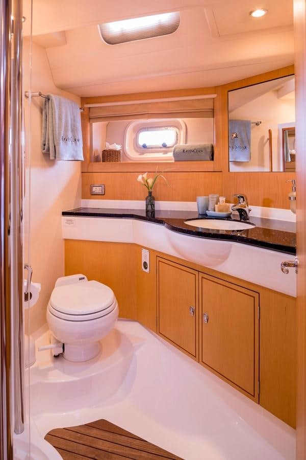 a bathroom with a toilet and a sink aboard RAVENCLAW Yacht for Sale