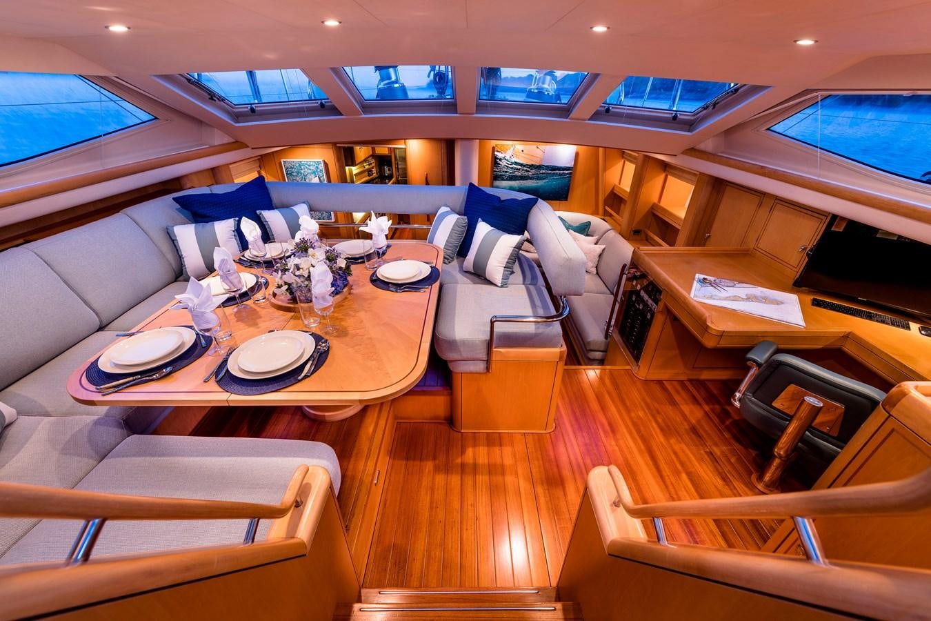 a room with tables and chairs aboard RAVENCLAW Yacht for Sale