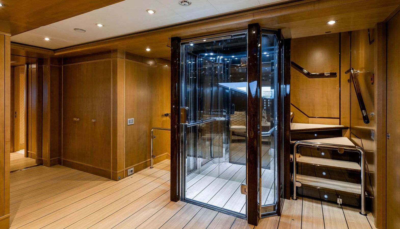 a large room with a glass door aboard CLELIA III Yacht for Sale