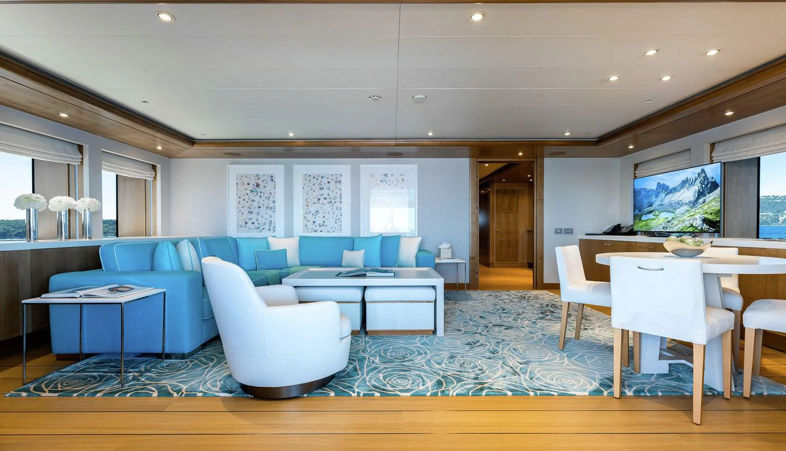 a living room with a couch and a table aboard CLELIA III Yacht for Sale
