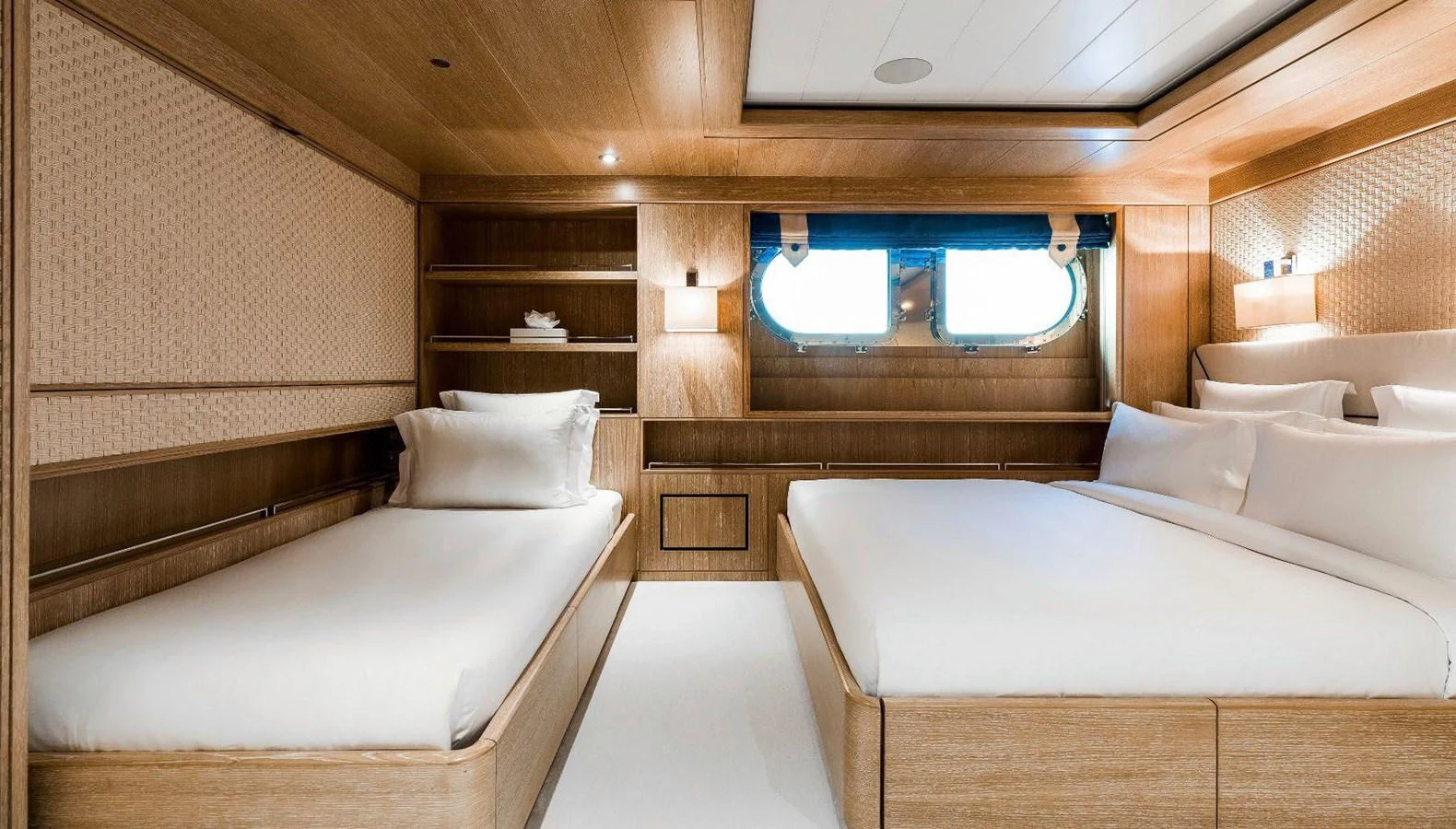 a room with a bed and a window aboard CLELIA III Yacht for Sale