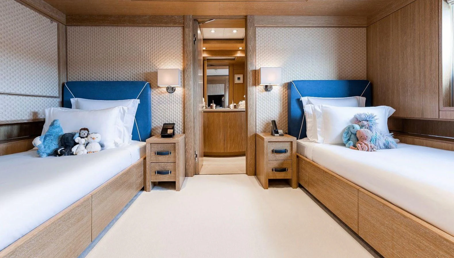 a bedroom with two beds aboard CLELIA III Yacht for Sale