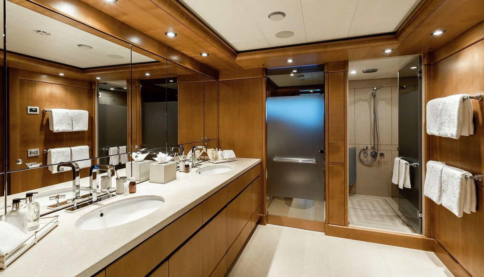 a bathroom with a large mirror aboard CLELIA III Yacht for Sale