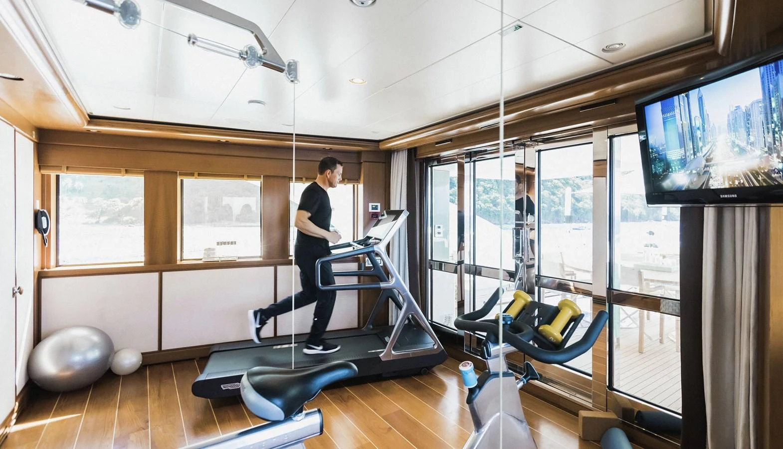 a person working out in a gym aboard CLELIA III Yacht for Sale