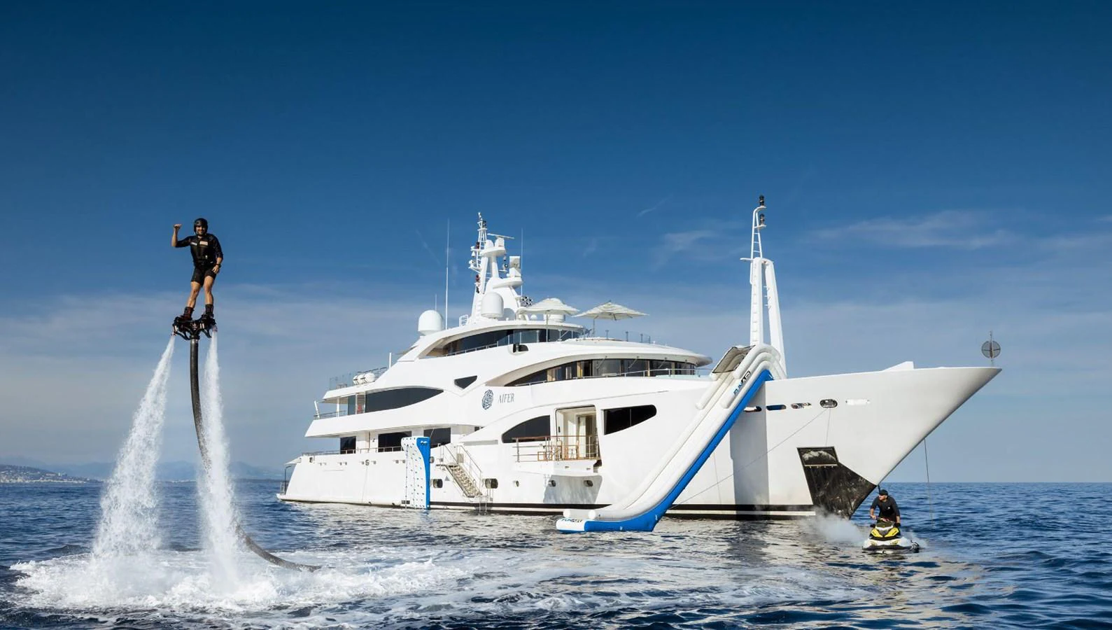 a boat with a person jumping out of it aboard CLELIA III Yacht for Sale