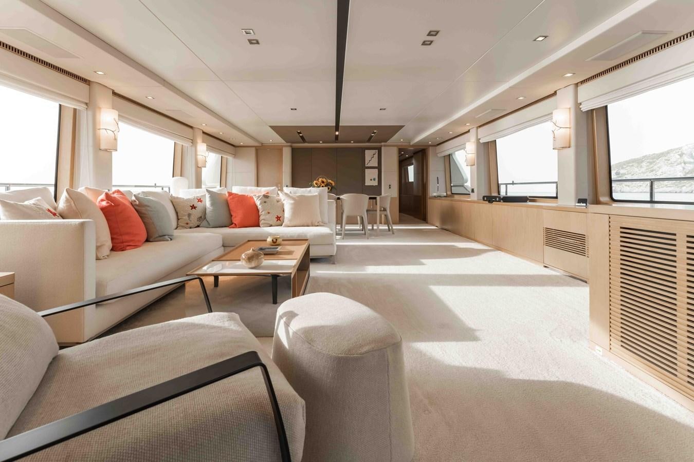 a living room with a couch and a table aboard COCONUTS Yacht for Sale