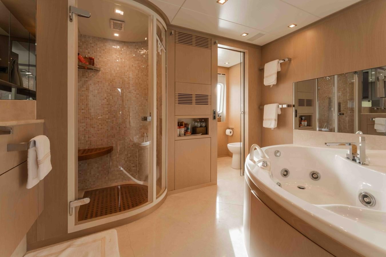 a bathroom with a glass shower aboard COCONUTS Yacht for Sale
