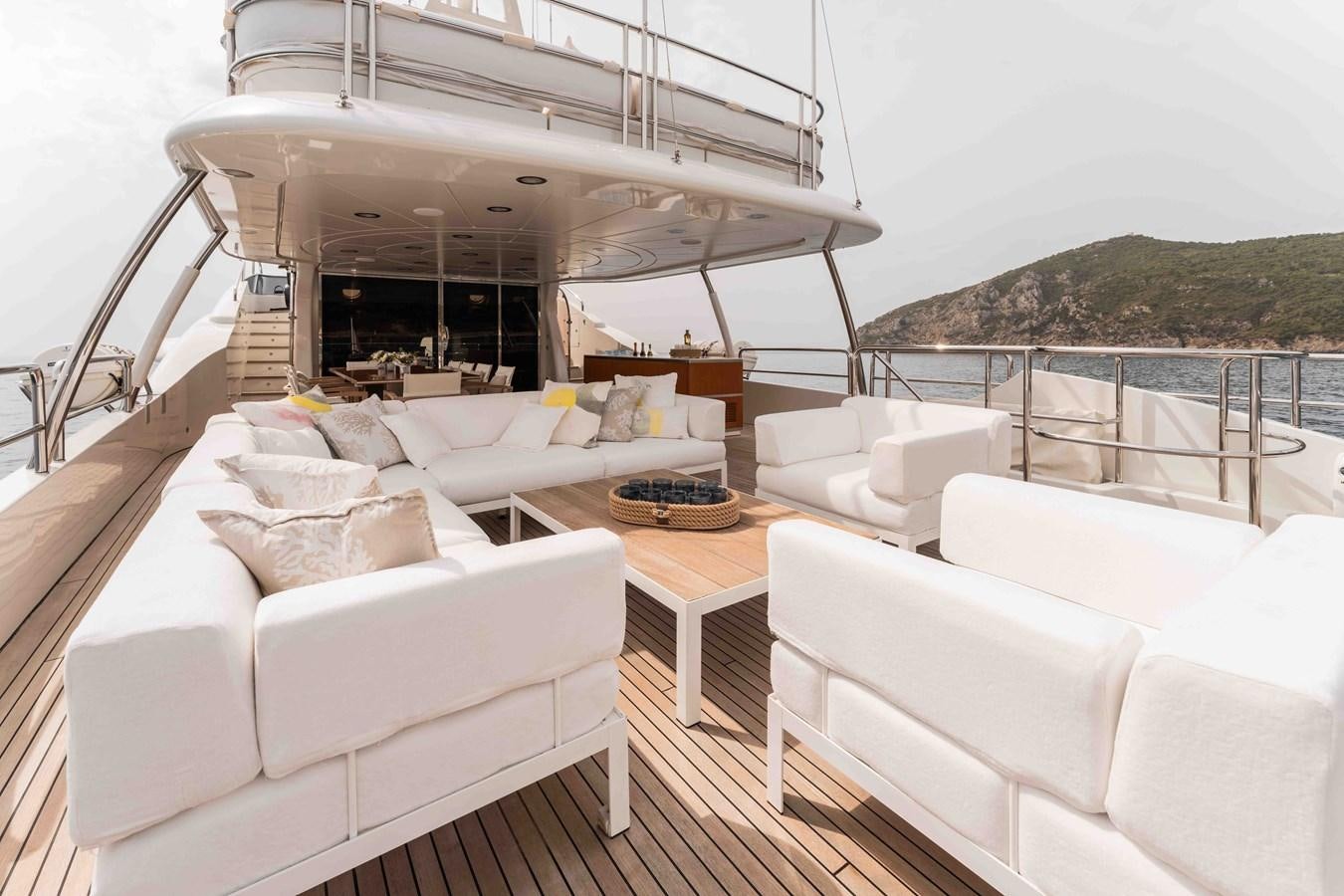 a living room with a large balcony aboard COCONUTS Yacht for Sale