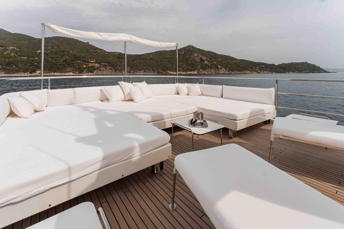 a room with a bed and a table on a boat aboard COCONUTS Yacht for Sale