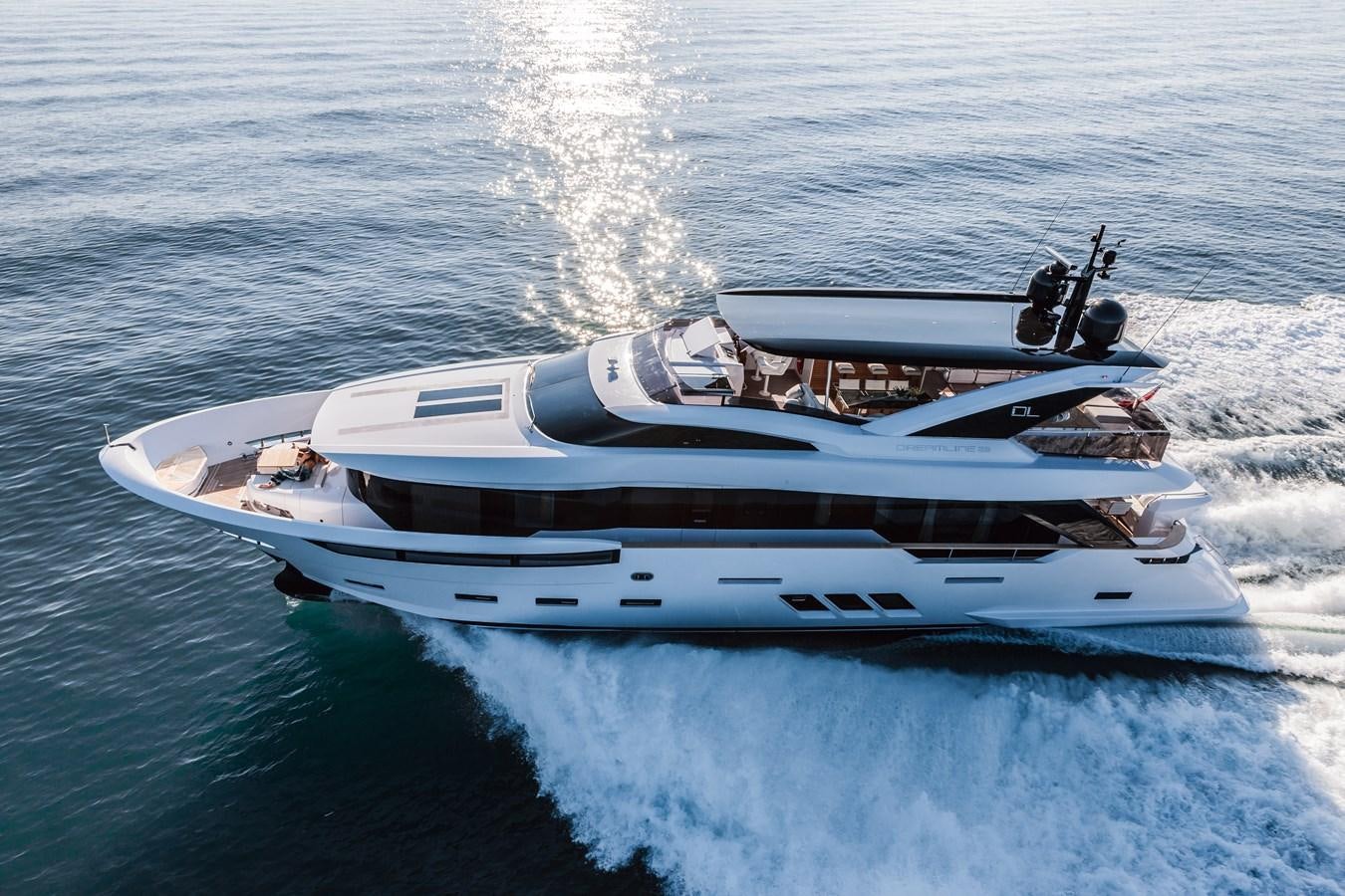 a white boat on water aboard DREAMLINE 35 Yacht for Sale