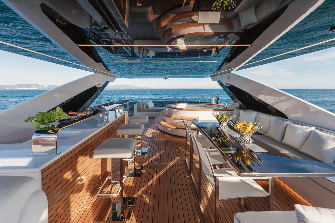 a deck with a pool and a deck with a view of the ocean aboard DREAMLINE 35 Yacht for Sale