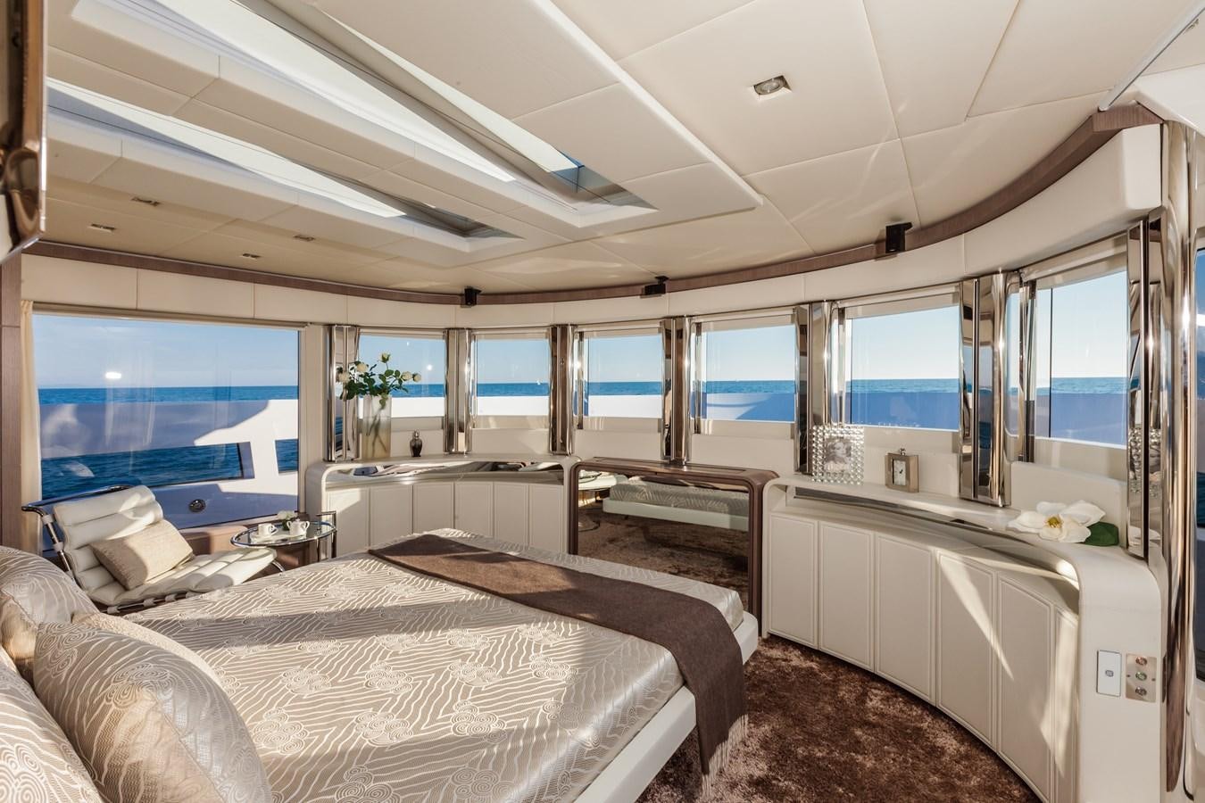 a room with a bed and a desk aboard DREAMLINE 35 Yacht for Sale