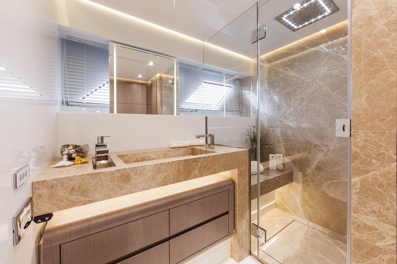a bathroom with a countertop sink and a shower aboard DREAMLINE 35 Yacht for Sale