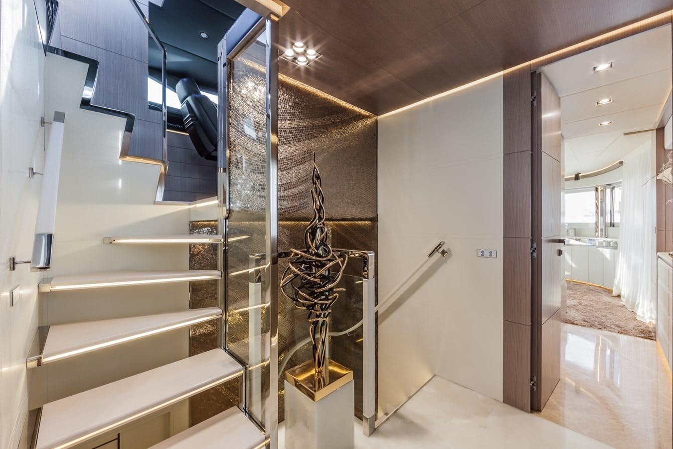 a staircase with glass walls aboard DREAMLINE 35 Yacht for Sale