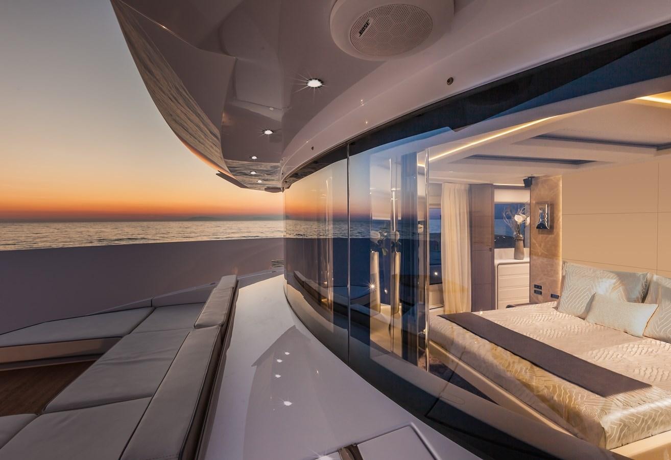 a room with a bed and a large mirror aboard DREAMLINE 35 Yacht for Sale