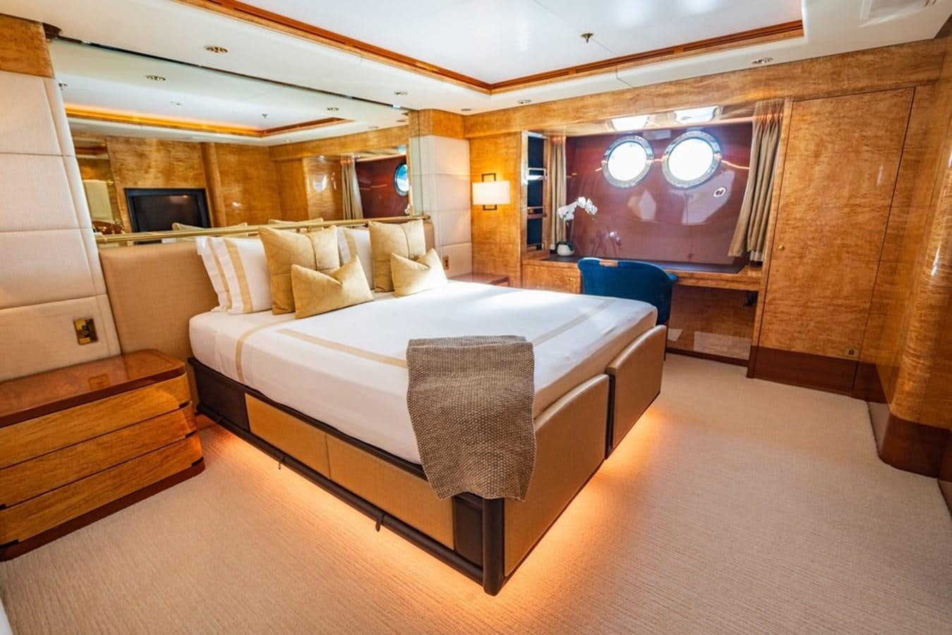 a bed in a room aboard AMADEUS Yacht for Sale
