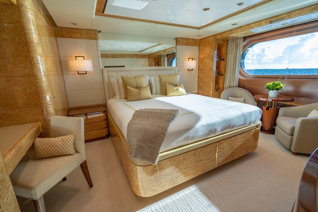 a large bed in a room aboard AMADEUS Yacht for Sale