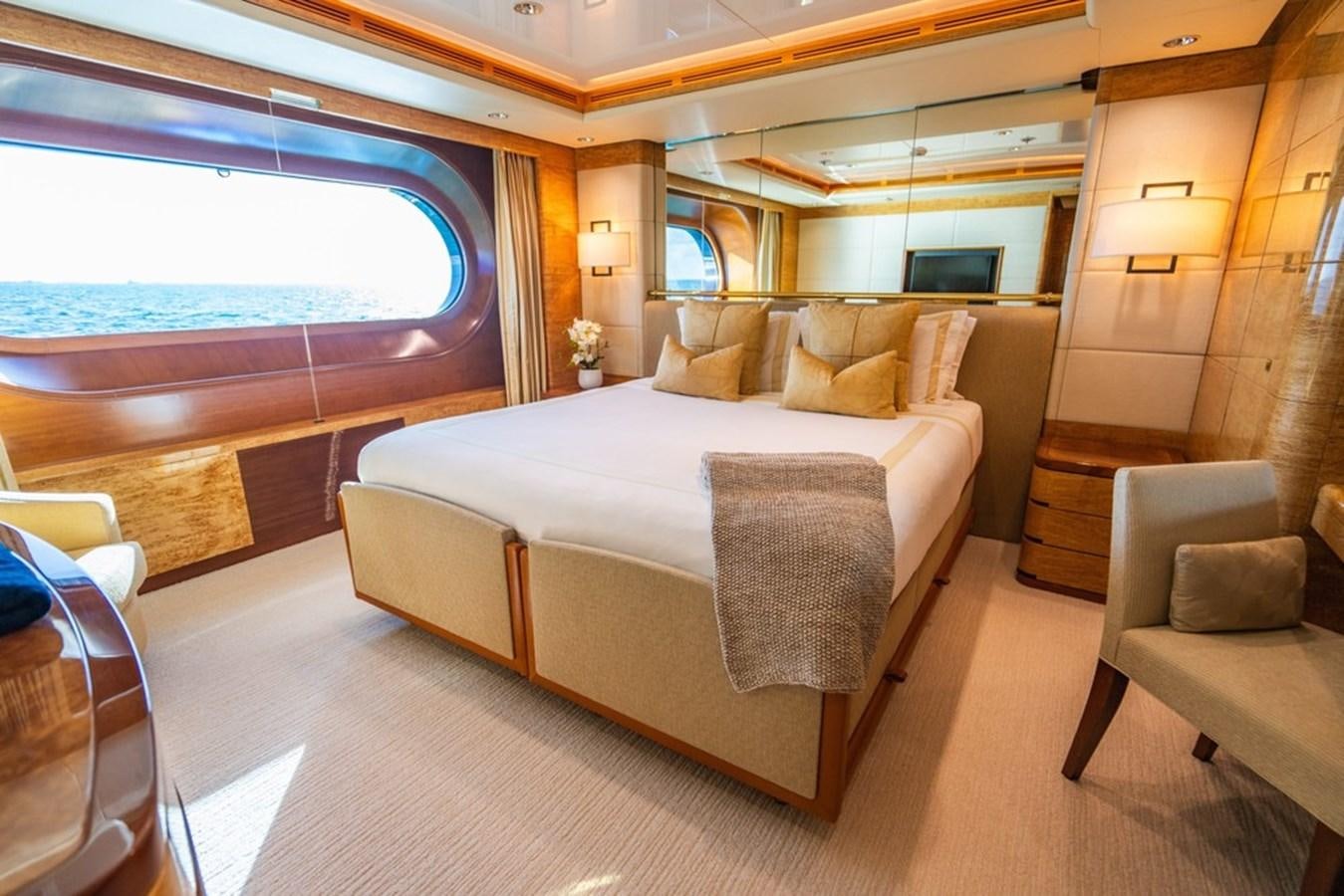 a large bed in a room aboard AMADEUS Yacht for Sale