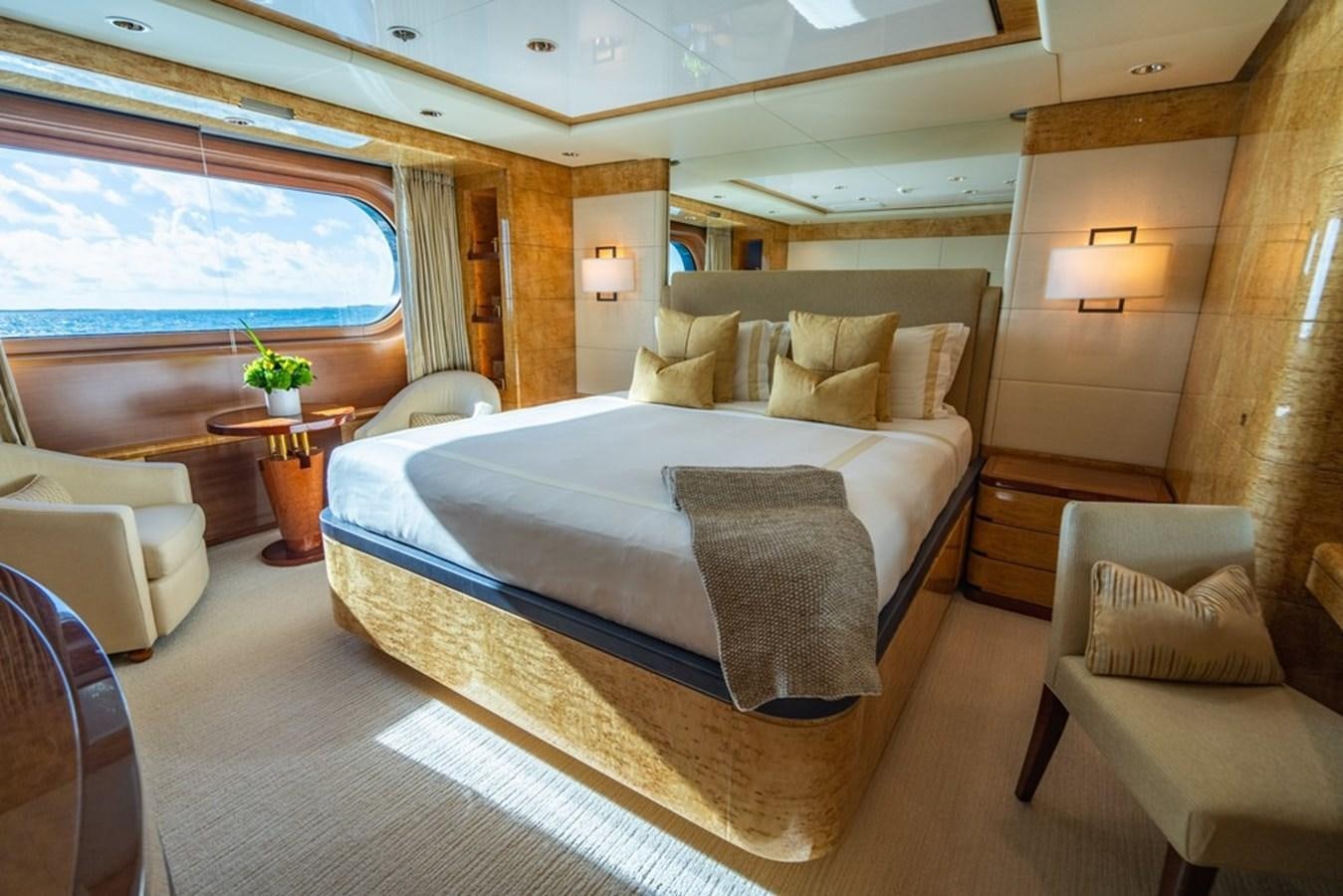 a large bed in a room aboard AMADEUS Yacht for Sale