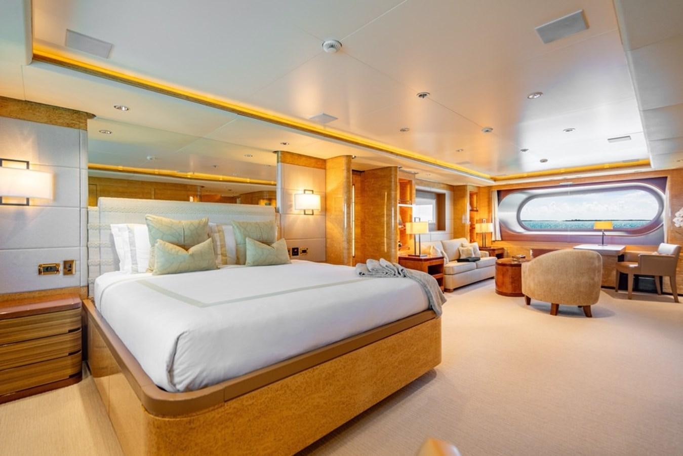 a large bedroom with a large bed aboard AMADEUS Yacht for Sale