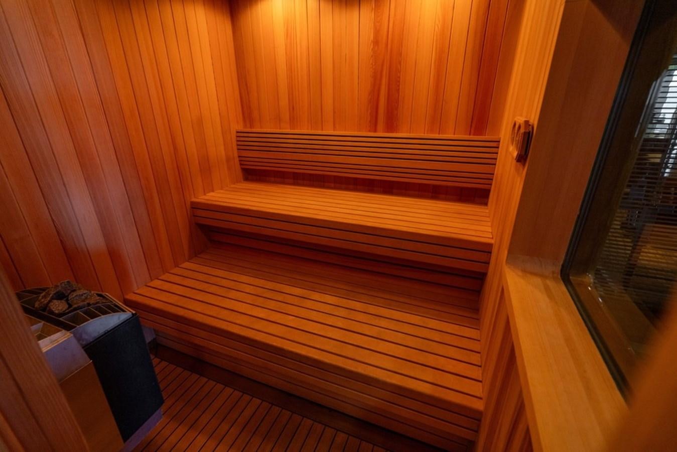 a wood shelf with a black object on it aboard AMADEUS Yacht for Sale