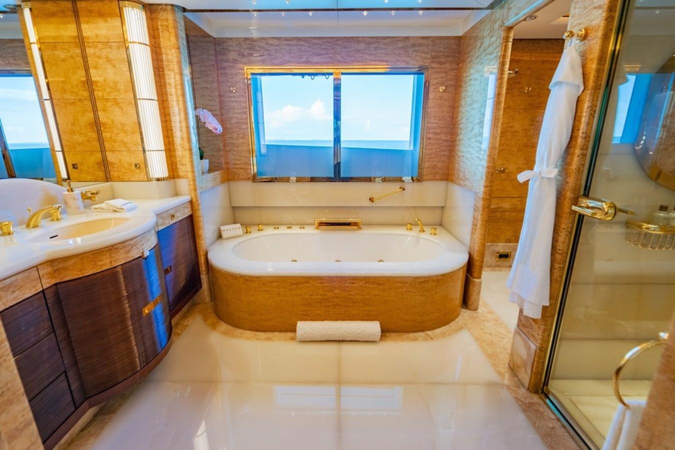 a bathroom with a tub and sink aboard AMADEUS Yacht for Sale