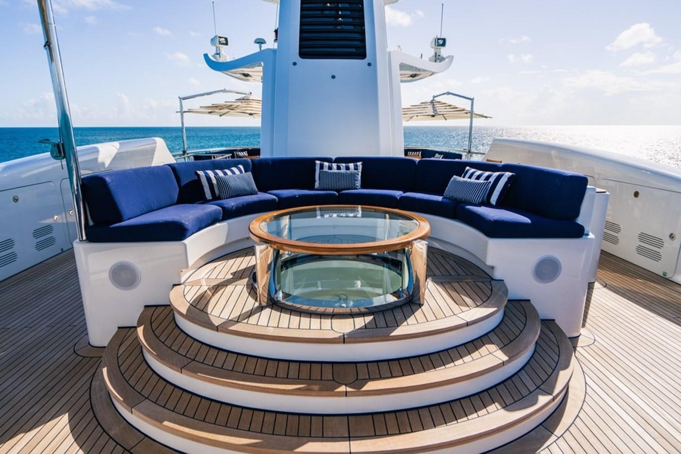a large swimming pool on a deck aboard AMADEUS Yacht for Sale