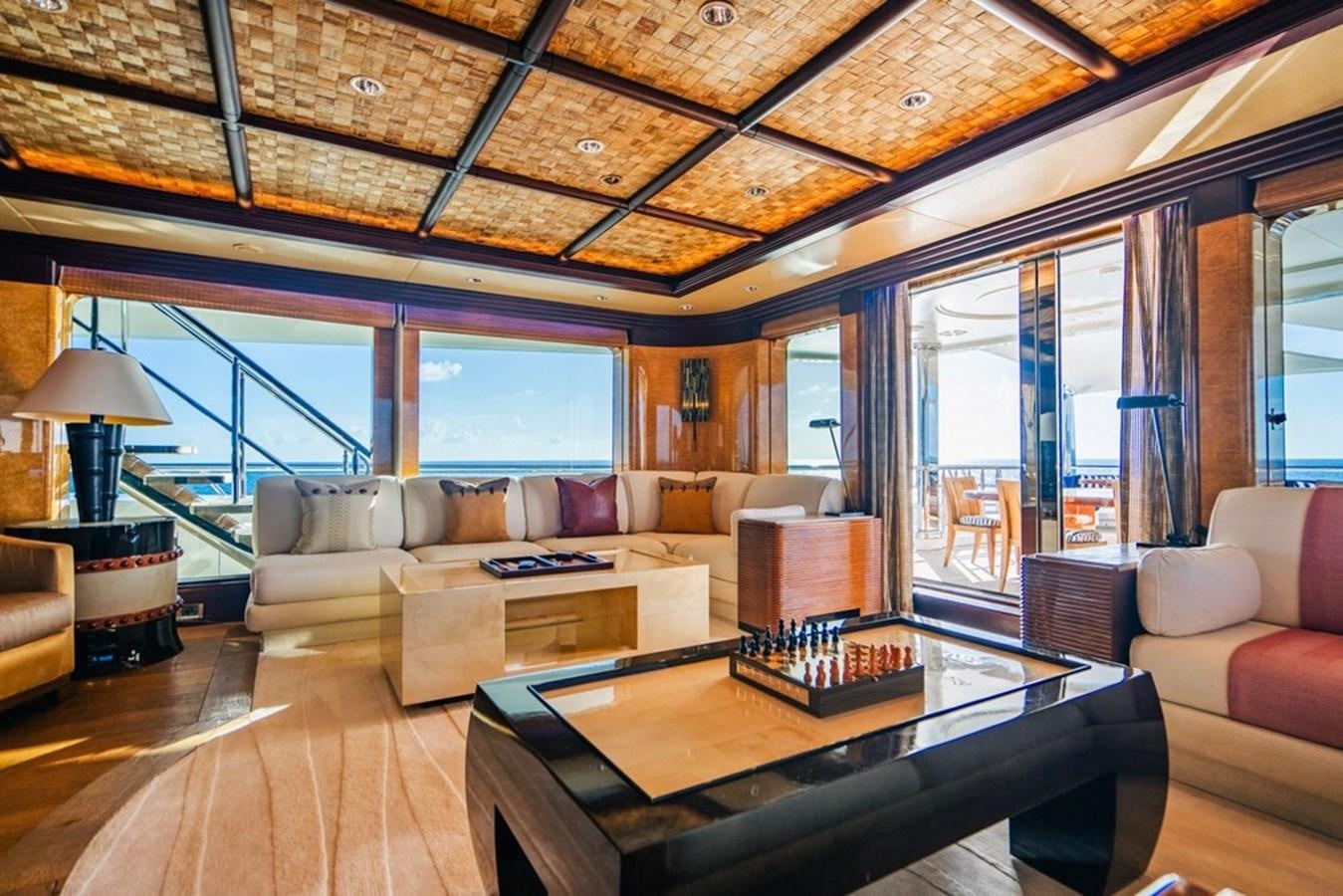 a living room with a large window aboard AMADEUS Yacht for Sale