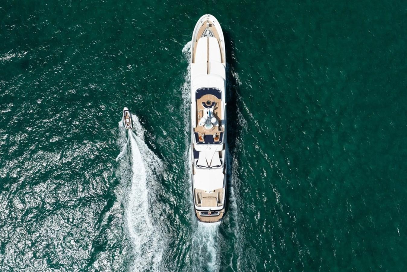a white and black vehicle on a blue surface aboard AMADEUS Yacht for Sale