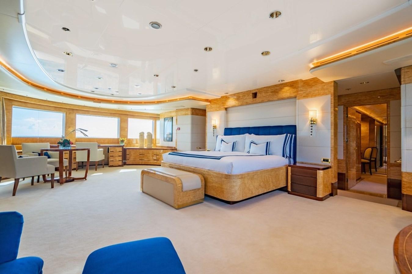 a large bedroom with a bed aboard AMADEUS Yacht for Sale