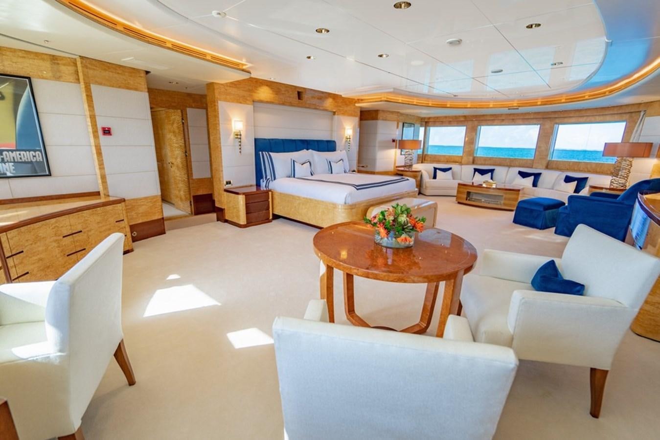 a room with a bed and a table aboard AMADEUS Yacht for Sale