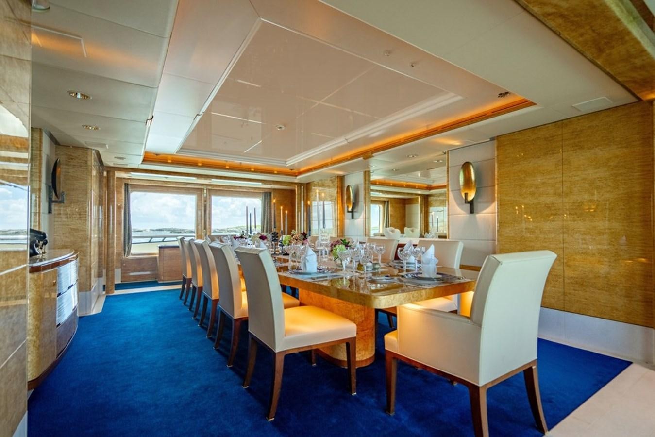 a large room with tables and chairs aboard AMADEUS Yacht for Sale