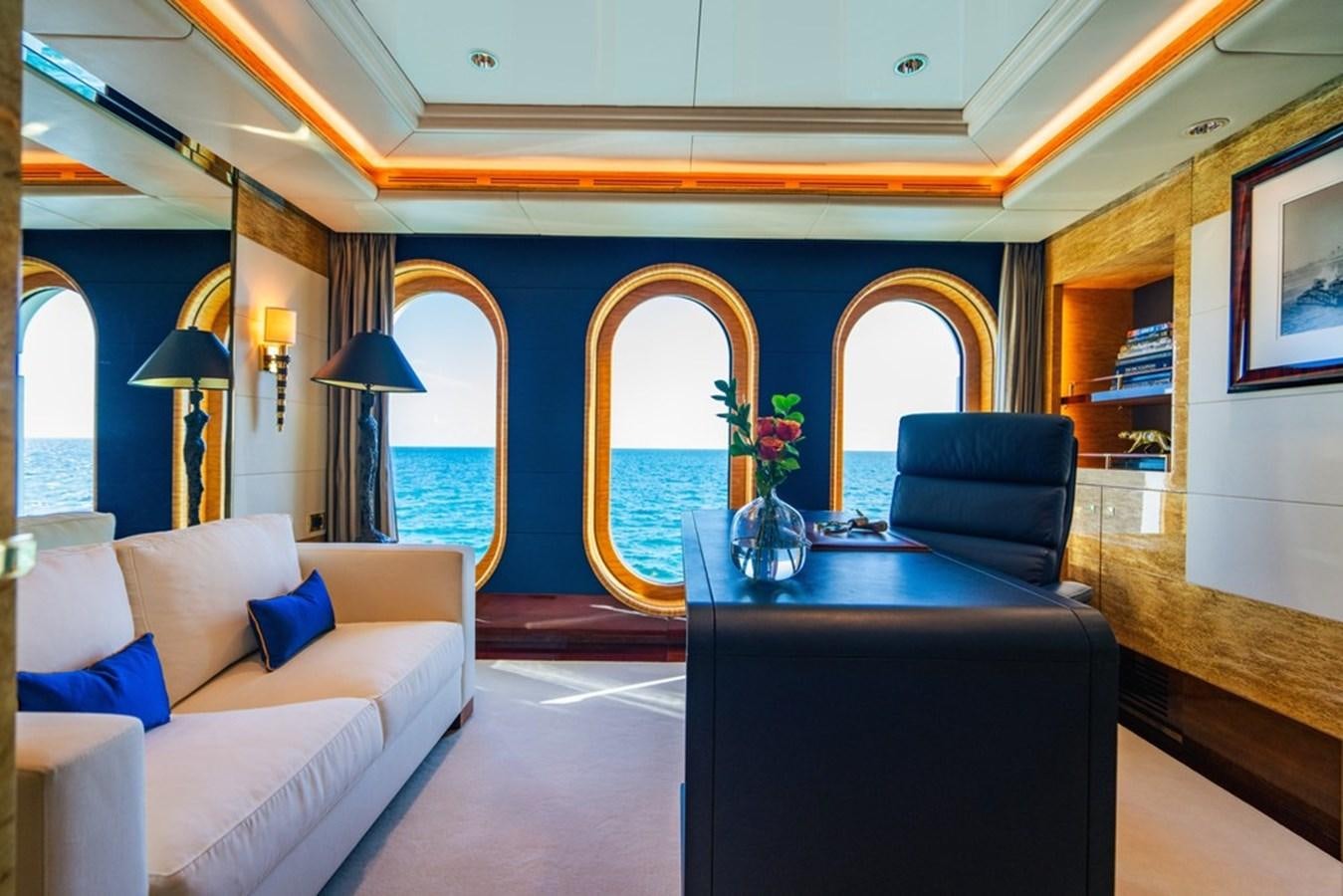 a room with a couch and a table aboard AMADEUS Yacht for Sale
