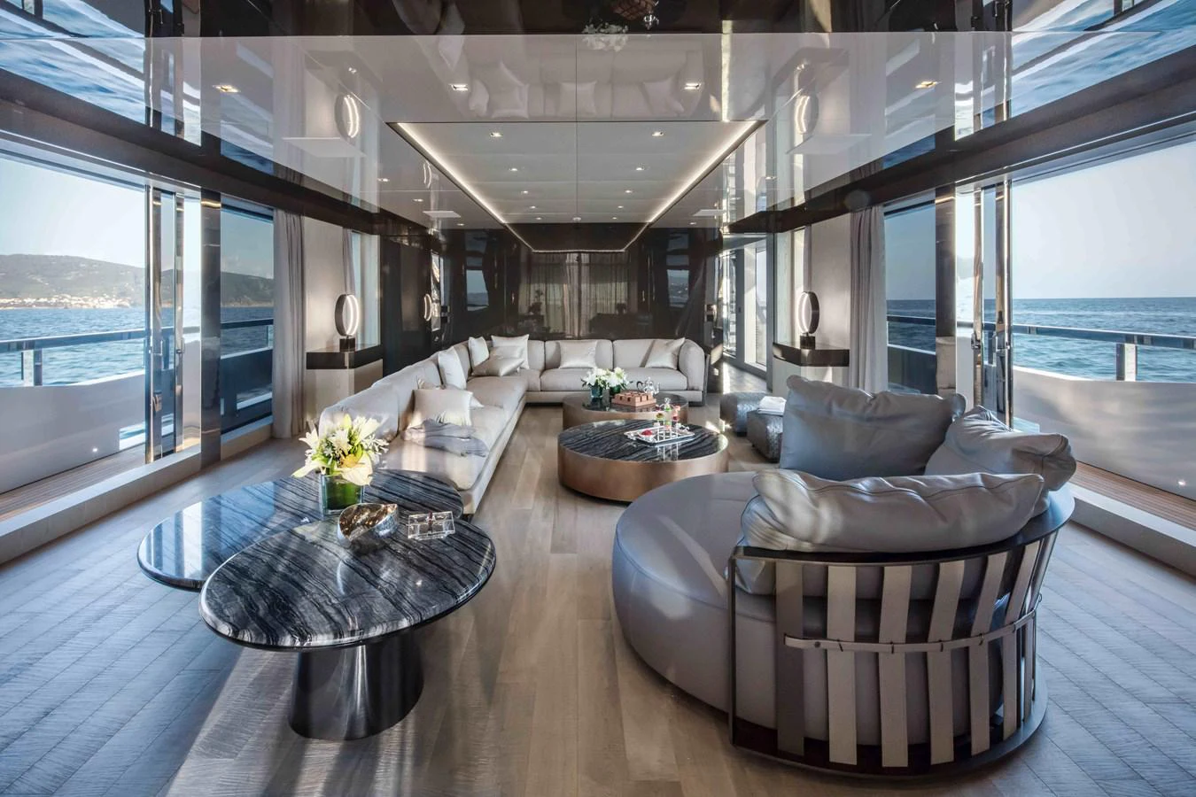 a living room with a large window aboard MA Yacht for Sale