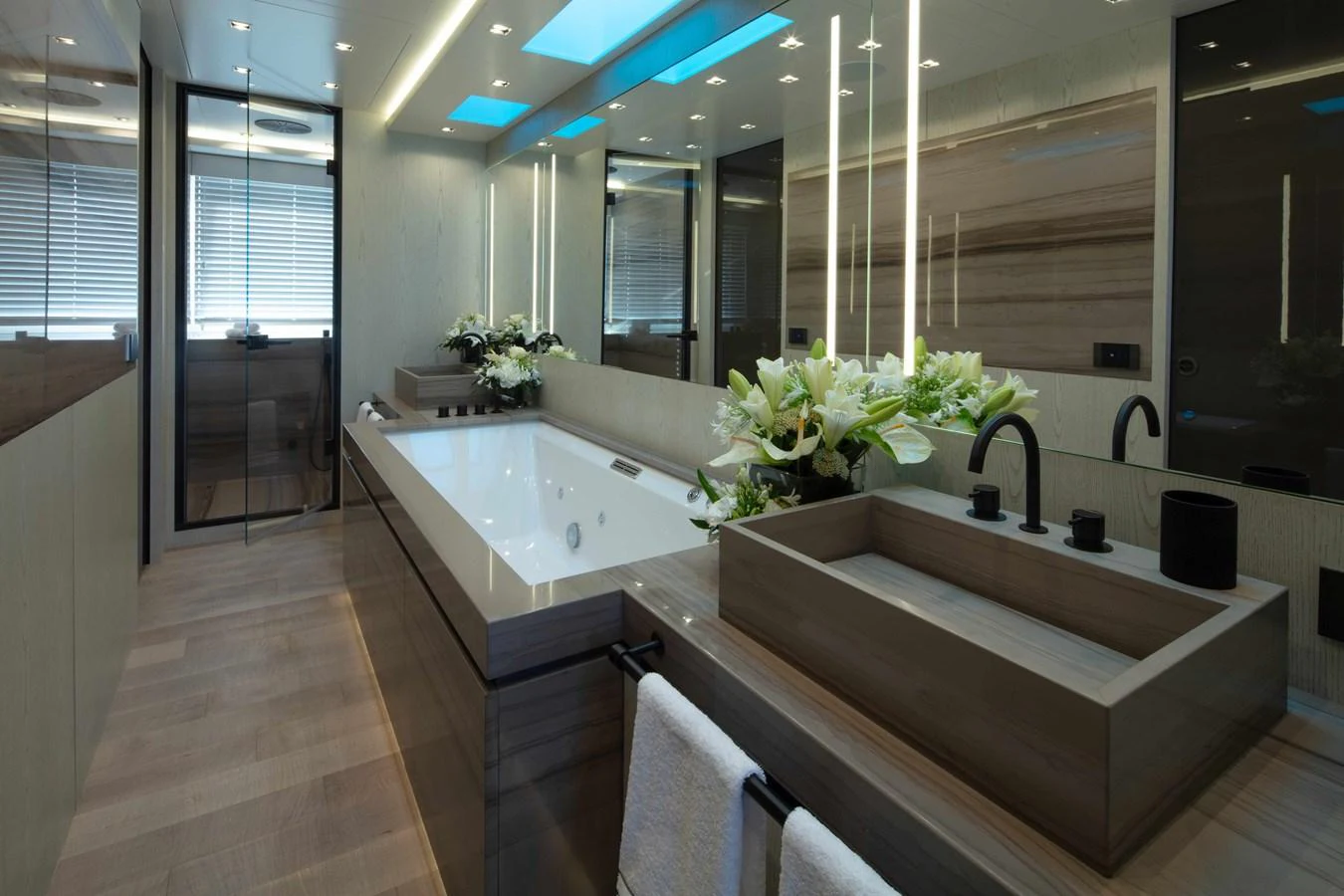 a bathroom with a large mirror aboard MA Yacht for Sale