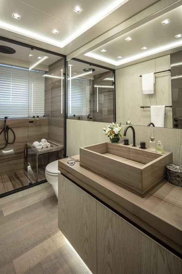 a bathroom with a large mirror aboard MA Yacht for Sale