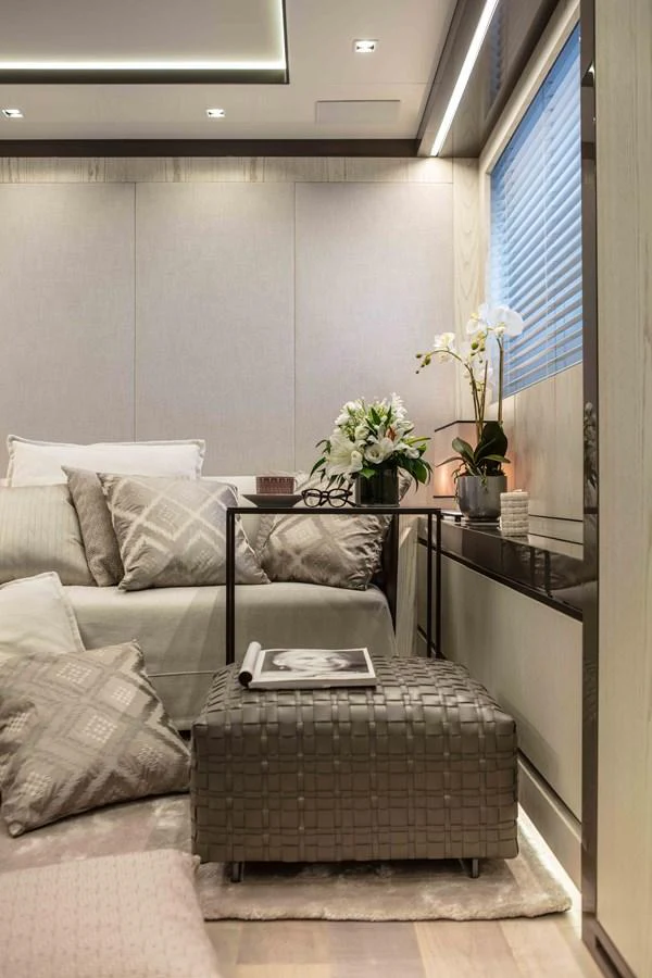 a living room with a couch and a coffee table aboard MA Yacht for Sale