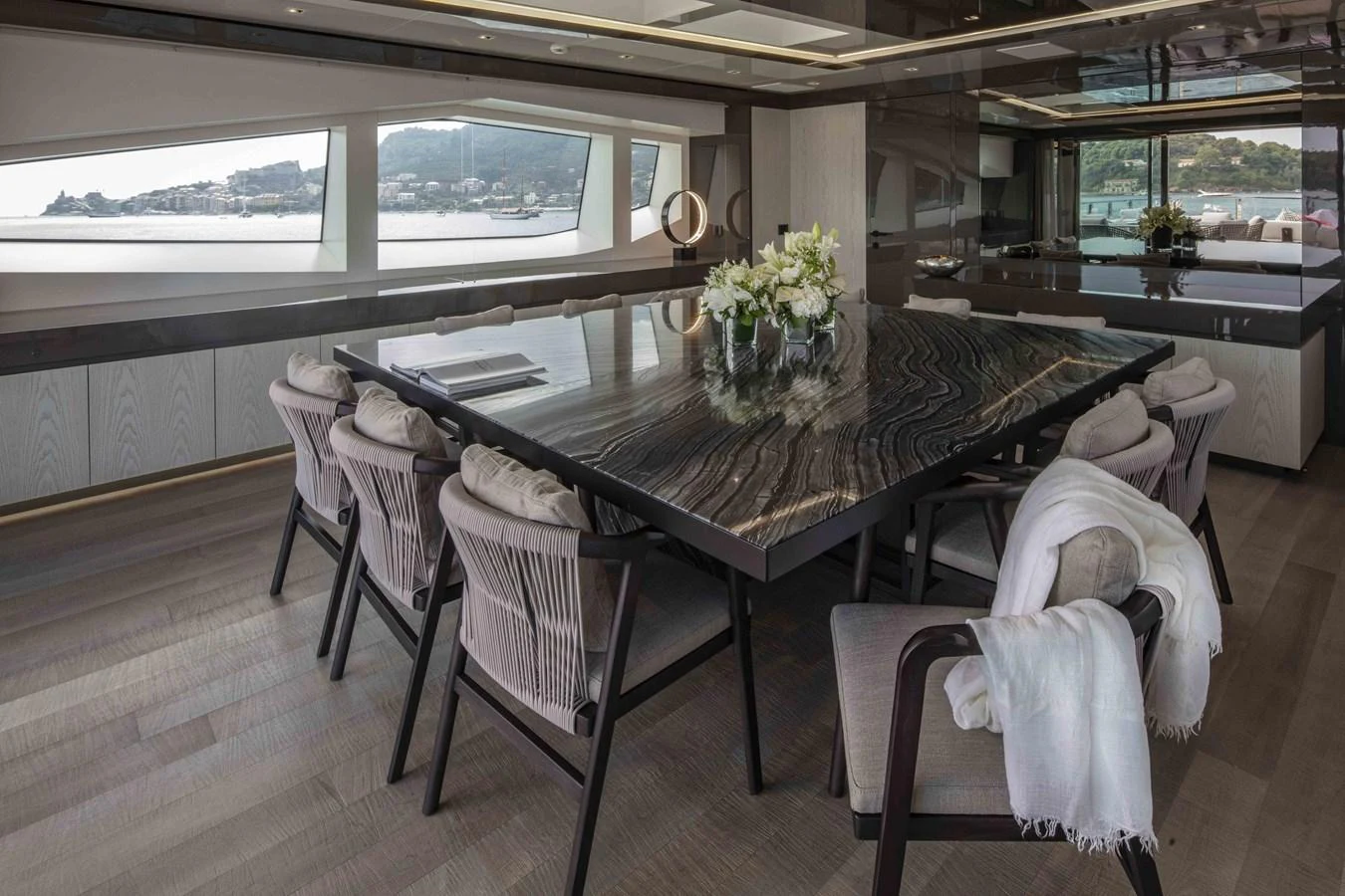 a dining table in a room aboard MA Yacht for Sale